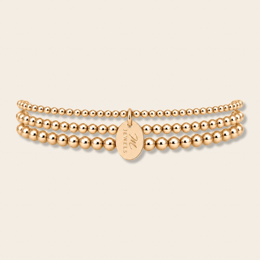 Signature Triple Stack – tři 14k gold filled náramky z kuliček 2 mm, 2,5 mm a 3 mm s oválným medailonkem MJewels